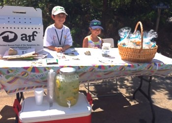 Adam and Eliza Liebowitz sell lemonade and lemon scented potpourri seashells at their Lemonarf Stand in Amagansett.