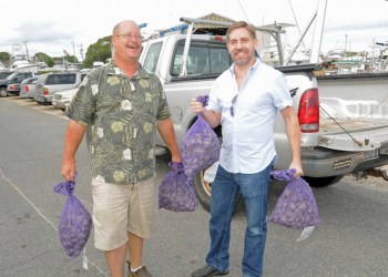 Montauk Friends of Erin's Joe Bloecke and Rich DeVore clamming it up at the 2013 Montauk Seafood Festival.