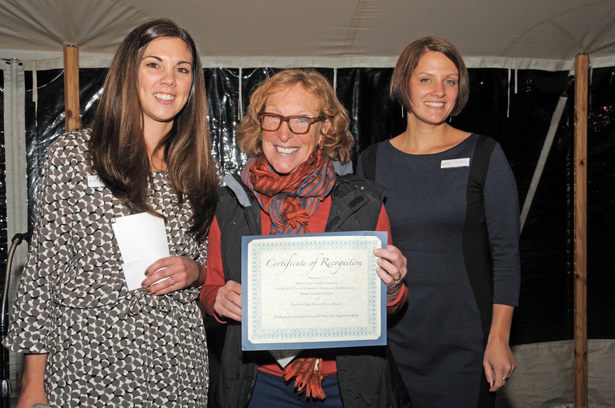 Cornell Cooperative Extension of Suffolk County's Outreach Specialist Kimberly Barbour and CCE's Sherryl Jones present a Sponsor Award to Nancy Windell, accepting on behalf of the Andrew Sabin Family Foundation