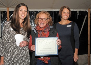Cornell Cooperative Extension of Suffolk County's Outreach Specialist Kimberly Barbour and CCE's Sherryl Jones present a Sponsor Award to Nancy Windell, accepting on behalf of the Andrew Sabin Family Foundation