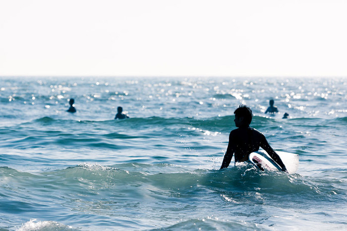 young surfers silhouettes