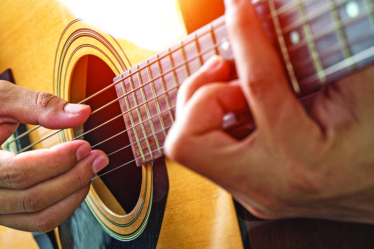 Jam on the acoustic guitar, electric guitar, bass or banjo, Photo: Witthaya Prasongsin/123RF
