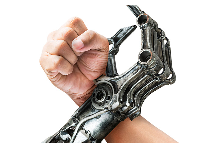 human arm and robot arm crossed