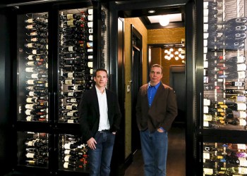 Joseph & Curtis founders Joe Kline and Curt Dahl in front of a fancy wine cellar