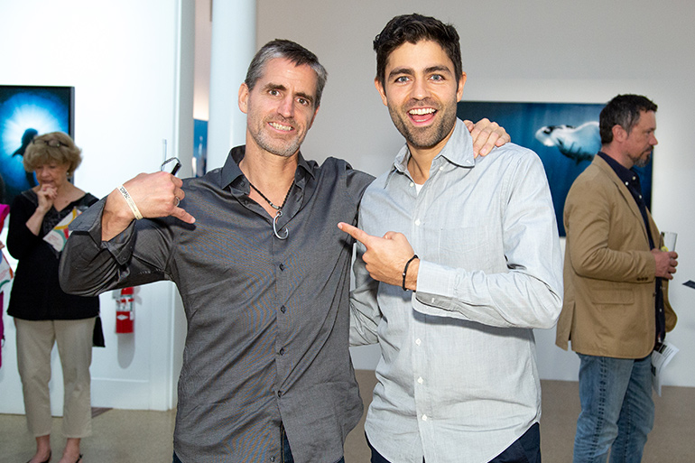 Shawn Heinrichs and Adrian Grenier at the opening of Light on Shadow at Southampton Arts Center