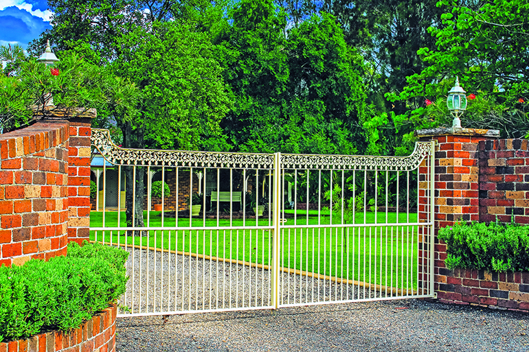 Brick fence and metal gate