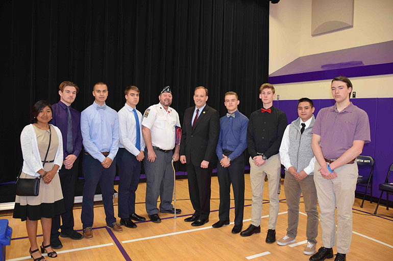 Daniel Stebbins with Lee Zeldin and Hampton Bays students, Photo: Courtesy Syntax