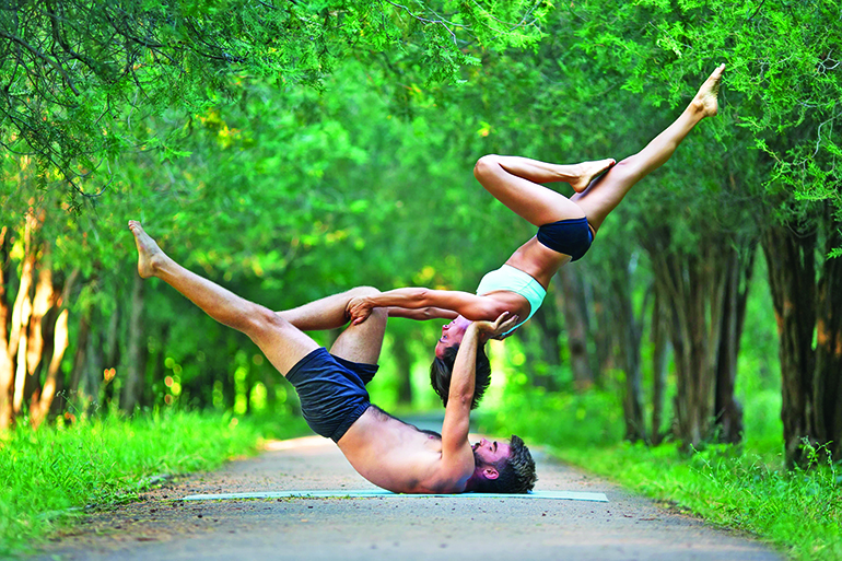 Partner yoga is easier than it looks, we hope, Photo: Glebstock/123RF