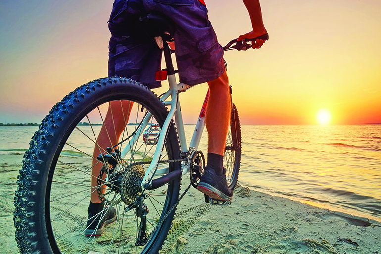Biking is a great way to explore while keeping your body and the Earth healthy, Photo: Levgenii Biletskyi/123RF
