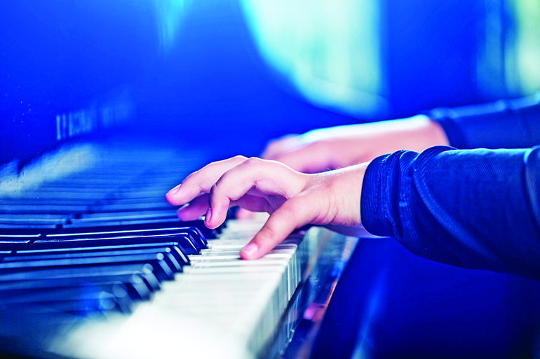 A pianist tickling the ivories, Photo: Olegdudko/123RF