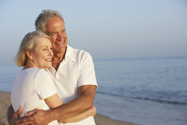 42400380 - senior couple enjoying beach holiday