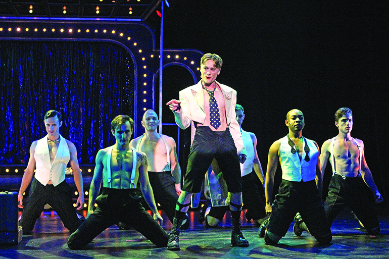 Josh Canfield as the "Cabaret" emcee with the Kit Kat Boys, Photo: Jeff Bellante