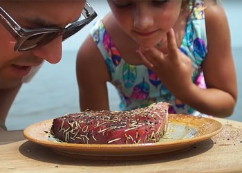 Cooking with Kyler father and daughter close up smelling Seared Tuna