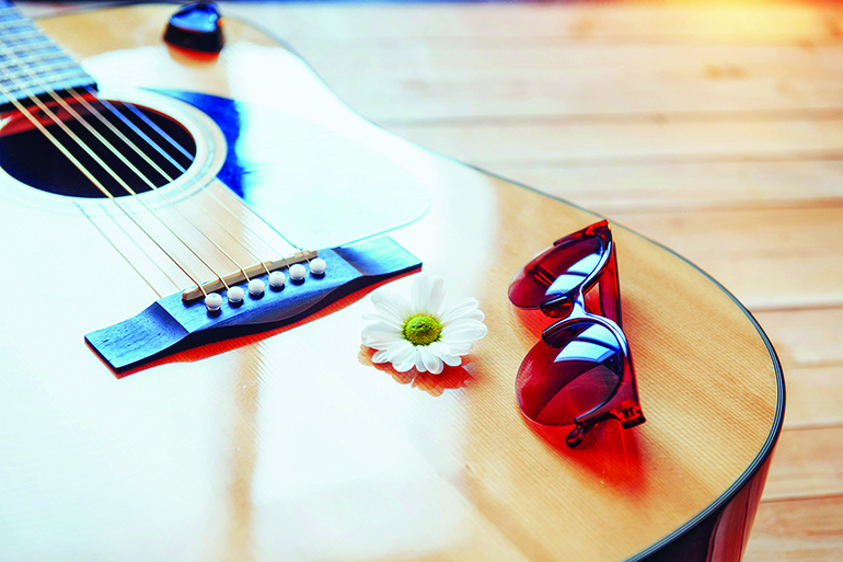 74624078 - detail of classic guitar with shallow depth of field.