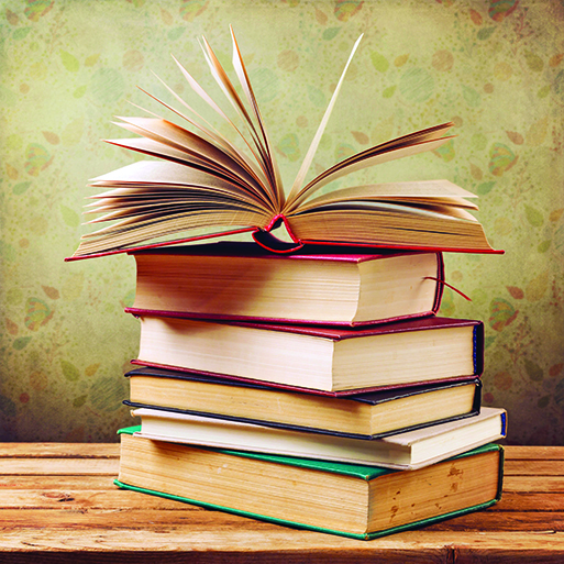 40129052 - vintage old books on wooden table over retro wallpaper background