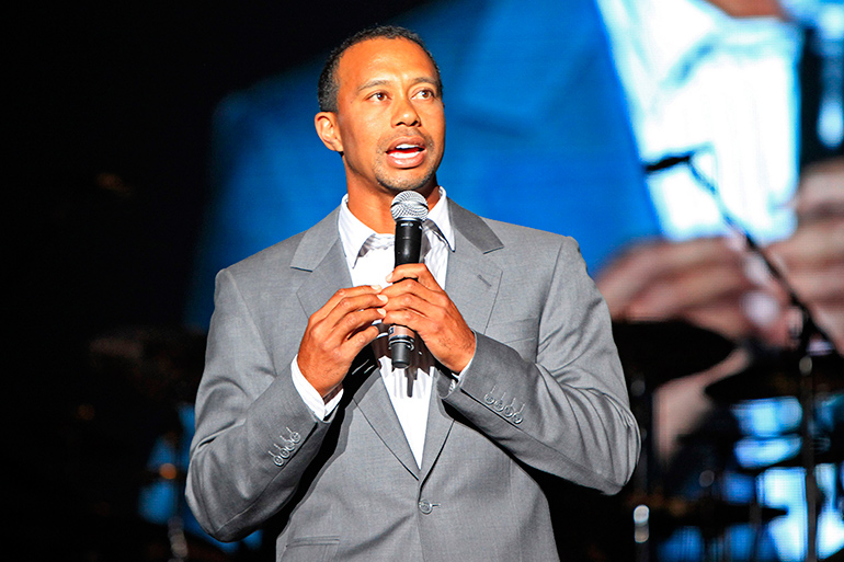 Tiger Woods holding a microphone