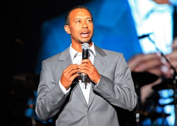 Tiger Woods holding a microphone