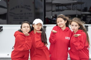 Priscilla, Angela, Grace and Sydney, all 13 years old, blew kisses in front of the 