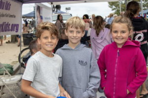 Classmates Nate, age 8, Ben, age 9, and Ginger, age 8, participated in fun kids activities at the event
