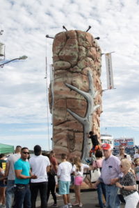 Children climbed the rock wall