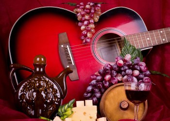 12376872 - beautiful composition with wine, grape, cheese and guitar on red background