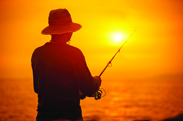 46656893 - fisherman silhouette at sunset near the sea with a fishing rod
