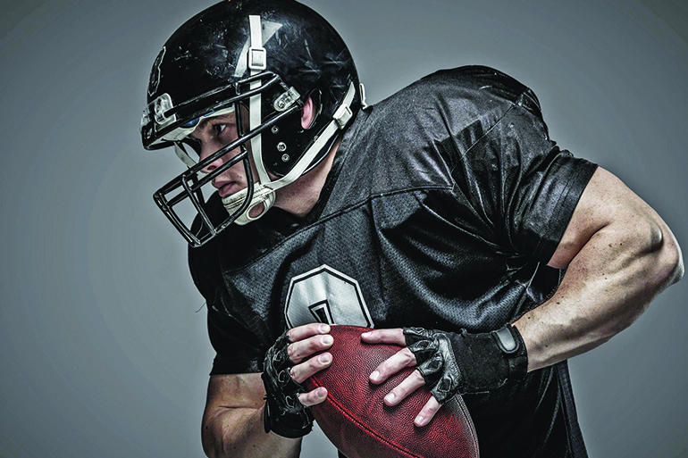 35747060 - american football player with ball