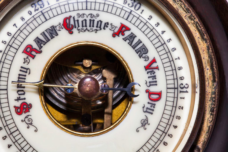 Vintage barometer forecasting stormy weather ahead