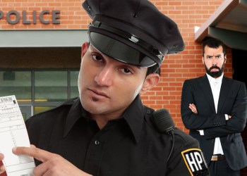 Hamptons Police office shows off ticket for violation of the casual dress code law in Sag Harbor while well dressed man pouts behind him