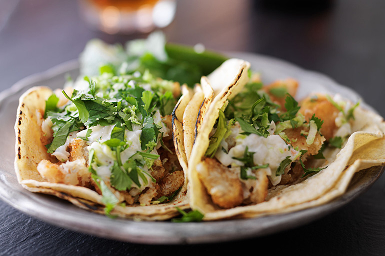 Fish tacos with slaw, lemon zest and cilantro