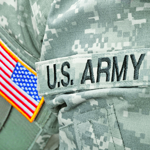 us army and flag patch on military uniform - close up shot