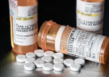 Opioid prescription pills and pill bottles: oxycodone, hydrocodone