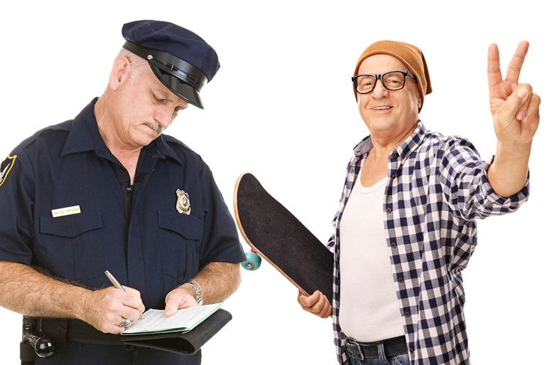 Policeman ticketing old skateboarder