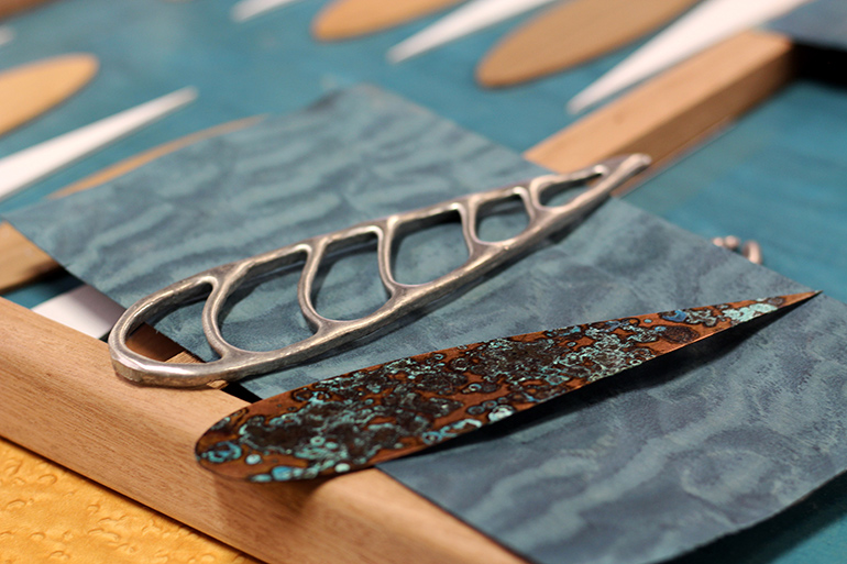 Metal backgammon points and quilted maple