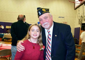 Veteran John Lenihan with his granddaughter, Kiarra O’Hagan, a fourth-grader at Hampton Bays Elementary