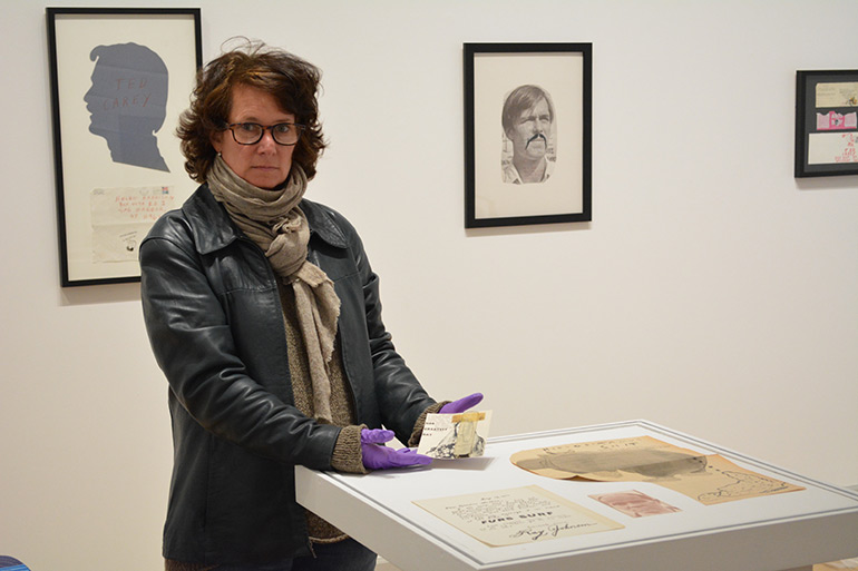 Jess Frost installing the Ray Johnson exhibition at Guild Hall