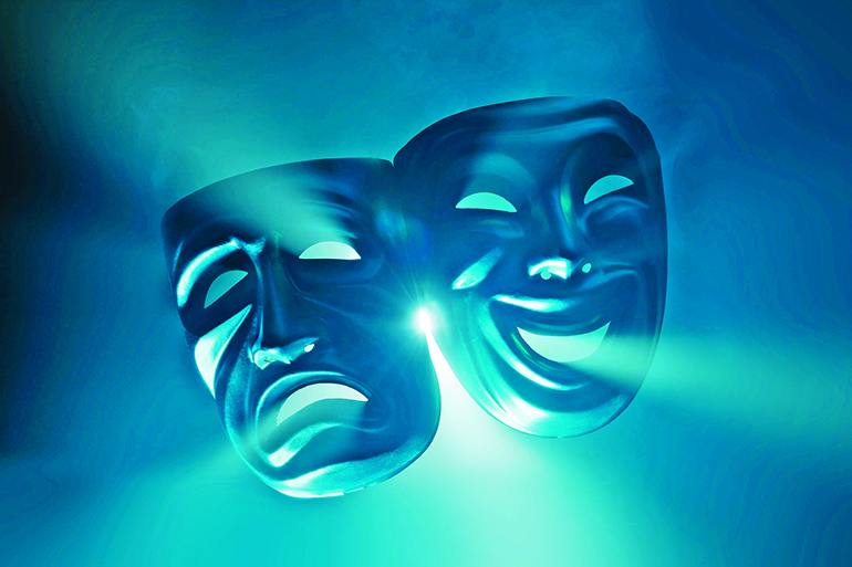 38738228 - crying and smiling masks in hazy light.