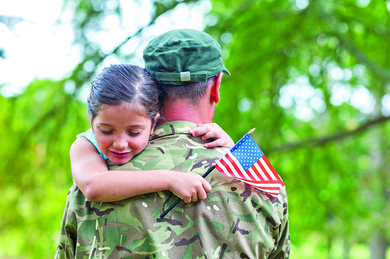 Soldier reunited with his daughter on a sunny day