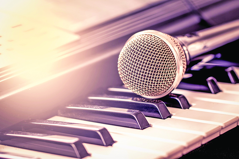 classical microphone on keyboard in vintage color tone