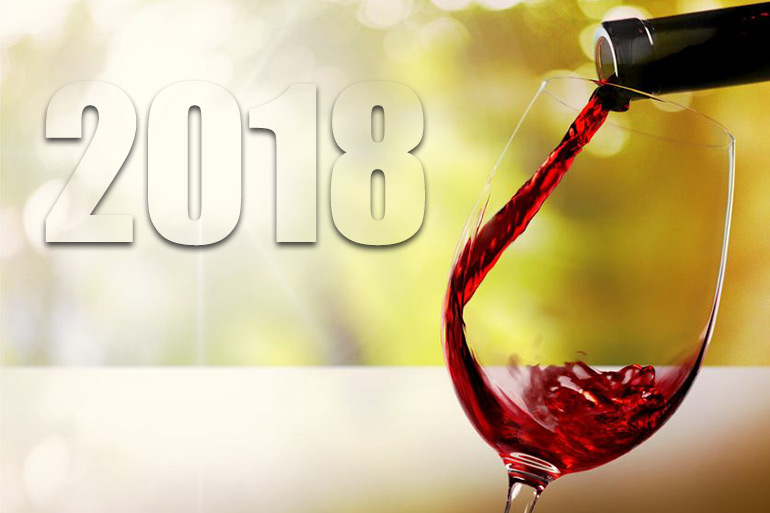 2018 wine moments - red wine pouring in glass with 2018 behind it