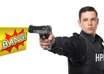 Hamptons police officer pointing gun with BANG sign coming out