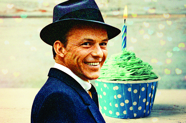 Delicious birthday cupcake on wooden table for Frank Sinatra birthday