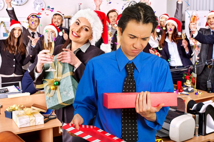 Guy disappointed with Yankee Swap gift at office Christmas party