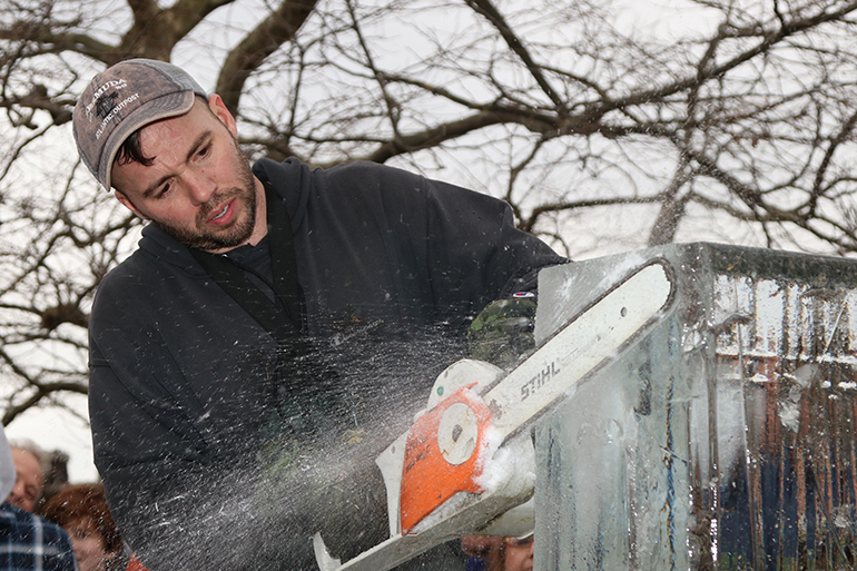 Rich Daly carving away at HarborFrost, Photo: Barbara Lassen