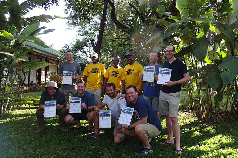 Chaloner Chute and his group hold Mt. Kilimanjaro certificates