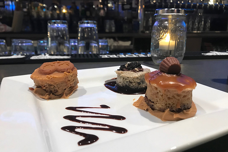 Cheesecake trio at The Clubhouse in East Hampton: Caramel Pretzle, Oreo / Cookies & Cream, and Reese's