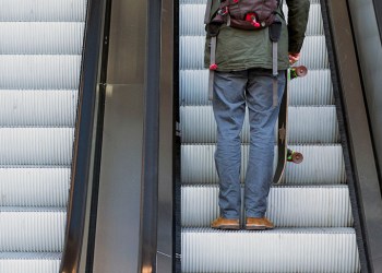 Skateboarder on Hamptons Subway escalator
