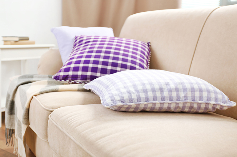 Interior design with pillows on sofa, closeup