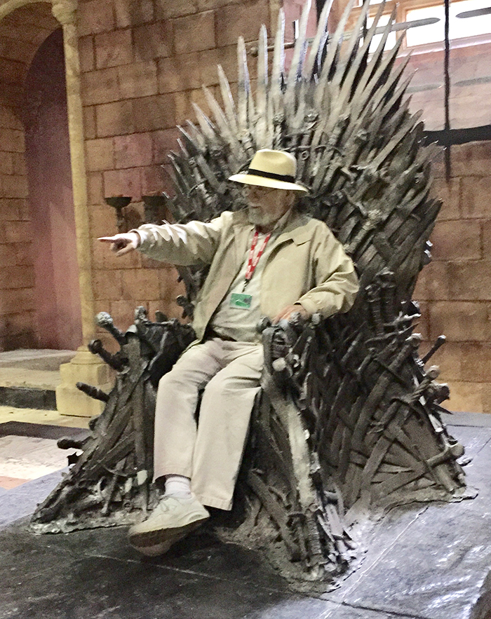 Dan Rattiner sitting on the Iron Throne at the Game of Thrones set