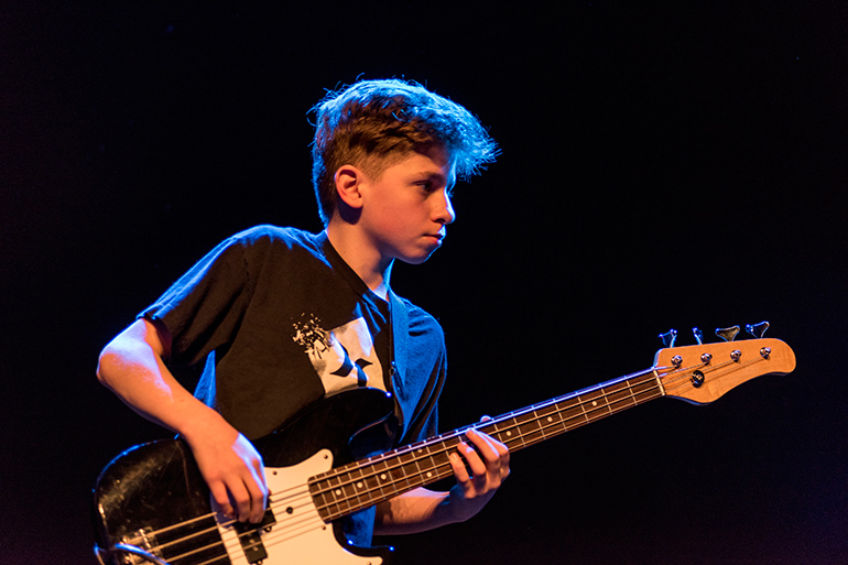 East End Arts Summer Camp boy with guitar